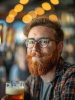 Man Red Beard Enjoying Craft Beer in Cozy Pub, Bokeh Background, Relaxed Setting, Portrait of a Hipster with Glasses Smiling, Warm Lighting, Casual Plaid Shirt, Social Atmosphere, Beer Day Celebration photo