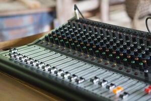 Sound audio mixer machine, amplifier for music with buttons on a mixing equalizer console. Concept, sound controler equipment for Dj or musicians to control level of different sound for entertainment. photo