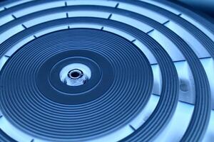 Accuracy concentric circles of varying thickness on a circular panel with blue lighting angle view photo