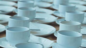 a row of empty cups can be a void waiting to be filled. The cups are still empty, open to be filled with anything. video