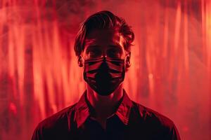 Trendy Male Model in Maroon Face Mask with Neon Coral Background Stylish and Modern Lifestyle portrait photo