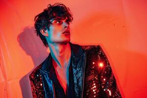 Stylish Male Model in Sequined Black Jacket with Neon Red Trendsetting portrait with Urban Setting photo