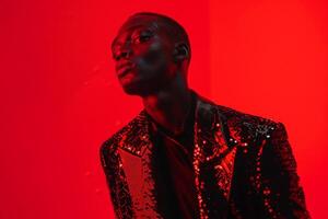 Handsome Male Fashion Male Model in Sequined Black Jacket with Neon Red Chic portrait with Urban Background photo