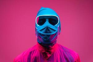 Stylish portrait of Handsome Male Model in Neon Teal Face Mask with Neon pink Background Trendy Males Lifestyle photo
