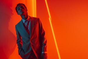 Tailored Suit Fashion Model with Neon Orange Background Modern Male Lifestyle portrait photo