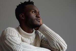 Fashion Model in Basic Sweater Medium Grey Background Relaxed portrait Modern Males Casual and Comfortable Style photo