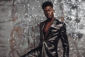 elegant Male Fashion Model in a Shimmering Suit with Silver Sequins perfect for Upscale Maleswear Lifestyle portraits with a Modern Twist photo