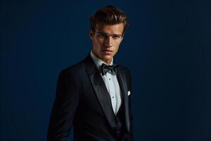 Upscale Fashion Model Featuring Classic Tuxedo with Deep Navy Blue Background Great for Formal and Stylish Maleswear portraits photo