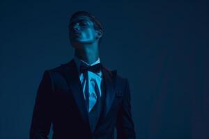 Trendsetting male model in a tailored tuxedo with Maleswear background showcased in a high fashion portrait with luxurious lifestyle eleMalets photo