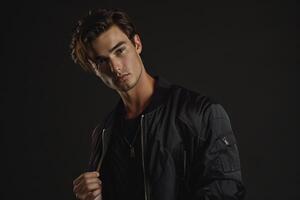 elegant male model in a zip up jacket with a dark charcoal background sophisticated portrait emphasizing contemporary fashion and modern outerwear styles photo