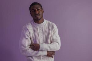 Fashion forward male model in a sweater with a soft lilac background chic portrait focusing on contemporary Males fashion and elegant sweater styles photo