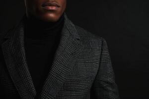 Fashionable male model in a tailored jacket with a charcoal background chic portrait showcasing contemporary and stylish Males fashion photo