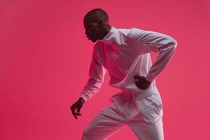 Stylish male model in a sporty tracksuit with a hot pink background emphasizing bold fashion and vibrant design with a modern athletic aesthetic photo