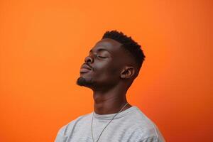 Fashionable male model in crewneck outfit electric orange background emphasizing a stylish and modern lifestyle with a chic portrait photo