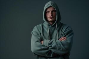 hoodie with a slate gray background emphasizing a modern lifestyle and stylish fashion portrait photo