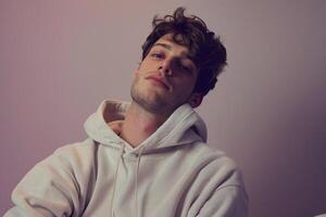 Soft Lavender Background and Male in Hoodie  Lifestyle portrait Showcasing Calming Style photo