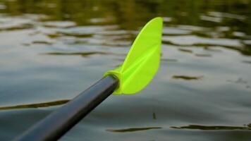Rafter swims in a kayak on the river. Close -up oar video
