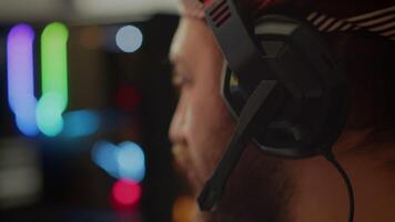 Close up of pro man streaming FPS shooter game on powerful computer during online gaming championship, talking into headset. Esport cyber team of gamers play in mock-up virtual videogame. video