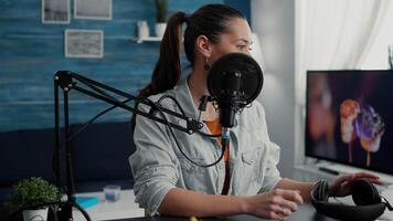 Professional podcaster putting headphones on head while starting to record . Creative digital content creator filming for channel while telling life stories to public. video