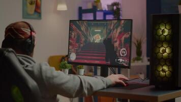 Game over for sad gamer playing shooter games on powerful computer using RGB keyboard in gaming room. Defeated man with headphones streaming online cyber performing through online tournament video