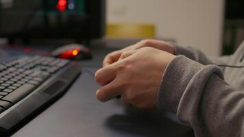Close-up of wireless joystick during online championship in gaming hone studio. Competitive player man playing game tournament with new graphics using professional RGB equipment video