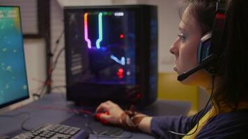 Competitive player using RGB equipment for live championship, playing on professional powerful computer. Online streaming cyber performing during gaming tournament using technology network wireless video