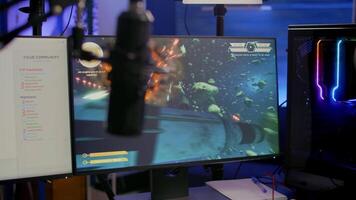 Game over for pro streamer playing online vide game space shooter in streaming room using modern headseat. Cyber performing on powerful pc talking with players on chat open during professional competition video