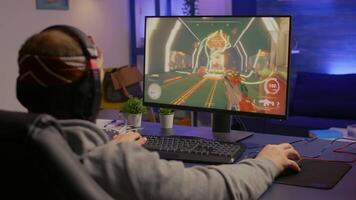 Game over for upset gamer playing on powerful computer first person shooter game during online tournament. Defeated man with headphones streaming online cyber performing late at night in gaming room video