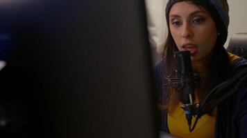 Close-up of pro streamer using RGB keyboard during online games competition. Cyber performing on powerful computer talking with players on chat open for professional tournament video