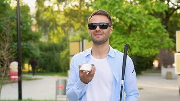 Blind man using voice control app in smartphone, innovations video