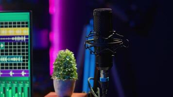 Empty home studio used to create music with electronic console and devices, pre amp knobs and soundboard with control panel. Space equipped with amplifier and tools, mixing and mastering. video