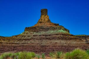 Layered geological formations of red rocks in Canyonlands National Park is in Utah near Moab. photo