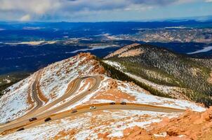 Winding road, serpentine in the mountains up to the Pikes Peak Mountain, Colorado, US photo