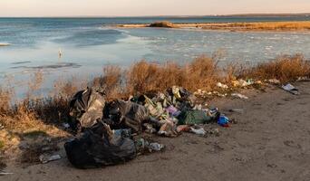 Pollution with plastic and household waste of nature on the shore of the Tiligul estuary, Ukraine photo
