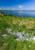 Environmental problem, pollution of the shores of a reservoir with construction and plastic waste, Khadzhibey estuary photo
