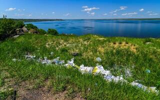 Environmental problem, pollution of the shores of a reservoir with construction and plastic waste, Khadzhibey estuary photo