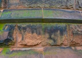 Elemental architectural design of the masonry, on which unicellular green algae grow on the walls at Princeton University. photo