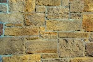 Antique brickwork of stones of various sizes photo