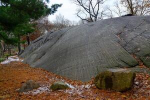 Rock slide in Manhattan Park in New York, layered geological formation photo