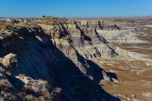 The Painted Desert on a sunny day. Diverse sedimentary rocks and clay washed out by water. Petrified Forest National Park, USA, Arizona photo