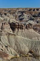 The Painted Desert on a sunny day. Diverse sedimentary rocks and clay washed out by water. Petrified Forest National Park, USA, Arizona photo