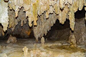 Calcite inlets, stalactites and stalagmites in large underground halls in Carlsbad Caverns National Park, New Mexico. USA photo