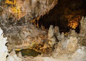 Calcite inlets, stalactites and stalagmites in large underground halls in Carlsbad Caverns National Park, New Mexico. USA photo