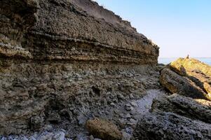 Layered shell-shore, destroyed by waves during storms, Black Sea photo