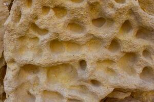 Weathering, erosion and destruction of limestone bricks of ancient structures on the island of Gozo, Malta photo