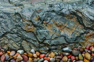 Multi-colored pebbles in the interior, round colored pebbles. photo
