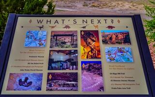 UTAH, USA - MAY 07, 2018 - information sign with information about extinct dinosaurs and their remains in nature in Utah, US photo