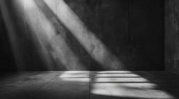 This minimalist concrete space highlights a dynamic interplay of light and shadow, serving as an ideal backdrop for product displays and presentations, with ample room for text and visuals photo