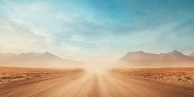 A tranquil and picturesque view of a deserted gravel road stretching into the distant horizon, framed by an expansive, arid landscape beneath an uninterrupted clear blue sky that inspires serenity photo