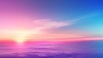 The sunset is mesmerizing, with vibrant pink, purple, and blue colors, casting an ethereal glow over the clouds photo